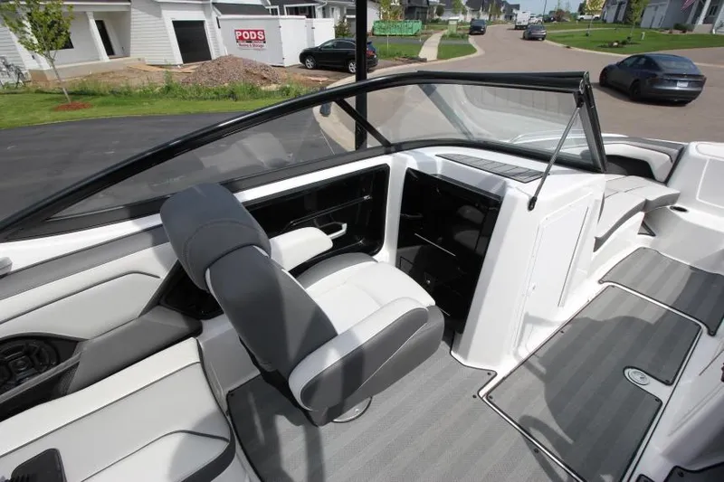 Slide: The Image of 2019 Yamaha Boats 212 Limited S interior cockpit with seating and dashboard. - 17