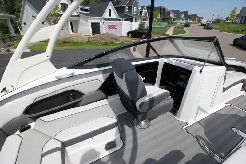 Slide: The Image of 2019 Yamaha Boats 212 Limited S interior, featuring sleek seating and modern dashboard. - 19