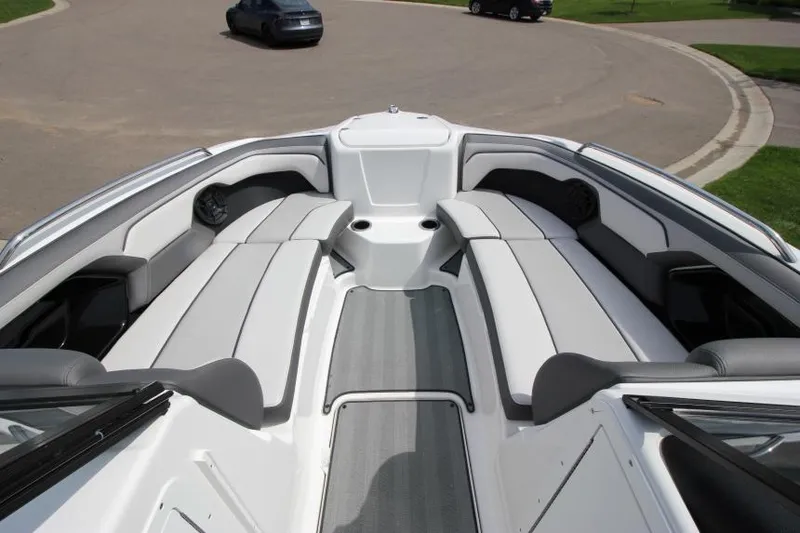 Slide: The Image of 2019 Yamaha Boats 212 Limited S interior seating area with gray and white upholstery. - 20
