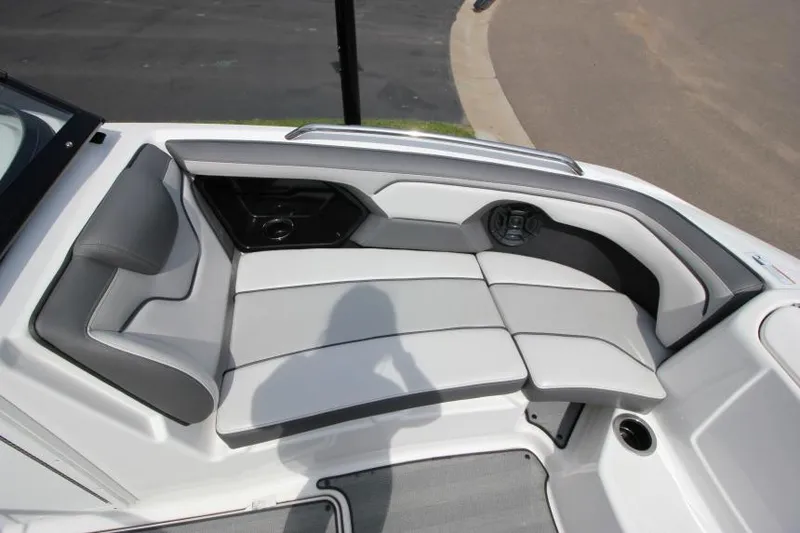 Slide: The Image of 2019 Yamaha Boats 212 Limited S interior seating area with gray and white upholstery. - 21