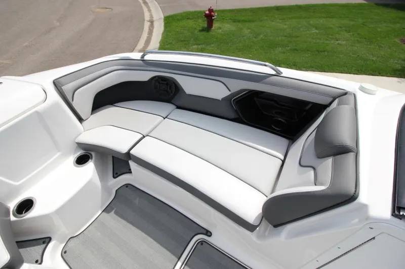 Slide: The Image of 2019 Yamaha Boats 212 Limited S interior seating area with gray and white upholstery. - 22