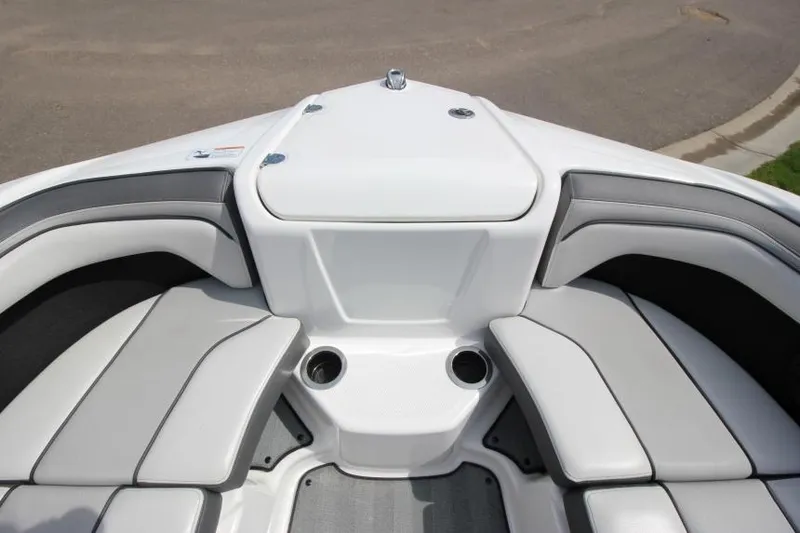 Slide: The Image of 2019 Yamaha Boats 212 Limited S bow seating area with cup holders. - 23