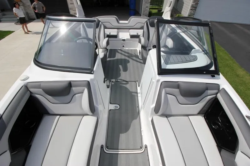 Slide: The Image of 2019 Yamaha Boats 212 Limited S interior with gray and white seating. - 25