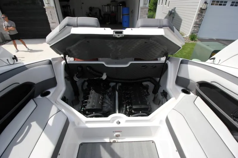 Slide: The Image of 2019 Yamaha Boats 212 Limited S engine compartment with open hatch. - 30