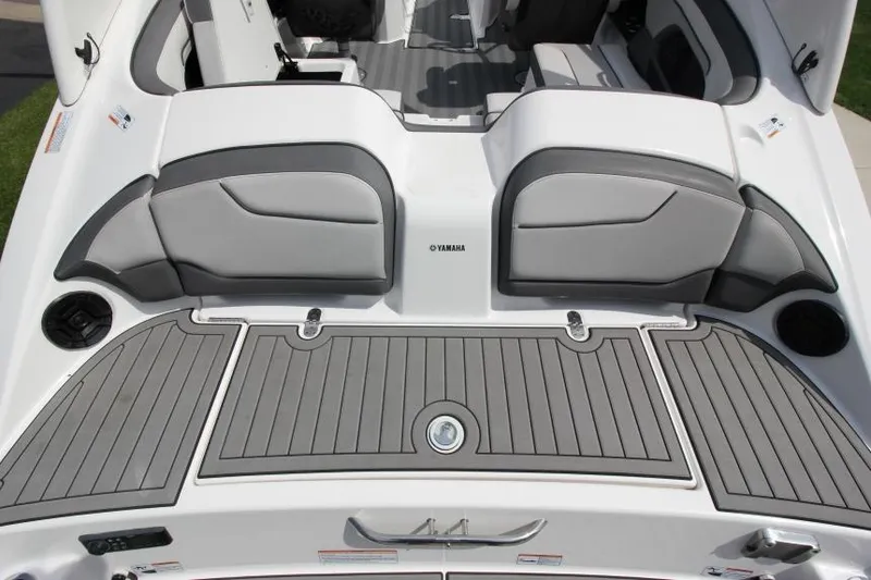 Slide: The Image of 2019 Yamaha Boats 212 Limited S rear deck and seating area. - 9