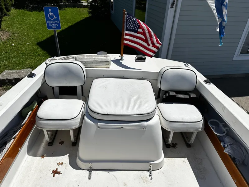 Slide: The Image of 1967 Bertram 20 Moppie boat interior with seating and American flag. - 5