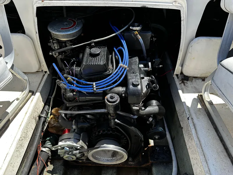 Slide: The Image of 1967 Bertram 20 Moppie boat engine compartment with visible engine components. - 9