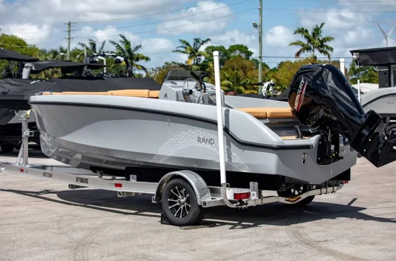 Slide: The Image of 2022 Rand BREEZE boat on a trailer with an outboard motor. - 11