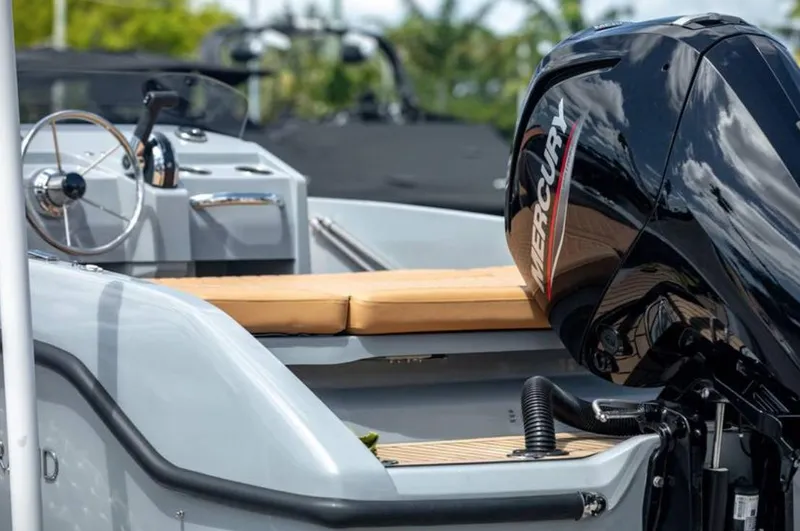 Slide: The Image of 2022 Rand BREEZE boat with Mercury outboard motor, featuring a sleek design and comfortable seating. - 13