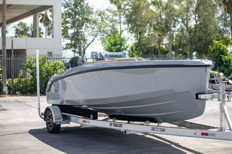 Slide: The Image of 2022 Rand BREEZE boat on a trailer in a parking lot. - 3