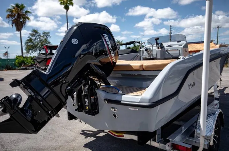 Slide: The Image of 2022 Rand BREEZE boat with Mercury outboard motor on trailer. - 9