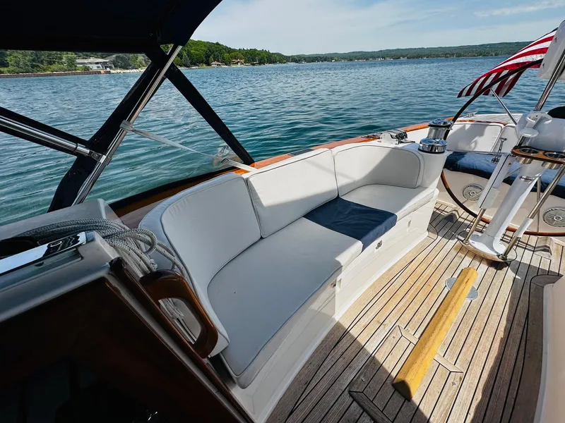 Slide: The Image of Alerion Express 38 sailboat cockpit with seating, 2009 model, on a serene lake. - 15