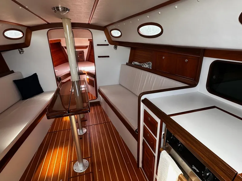 Slide: The Image of Interior of 2009 Alerion Express 38 sailboat with wood accents and white seating. - 20