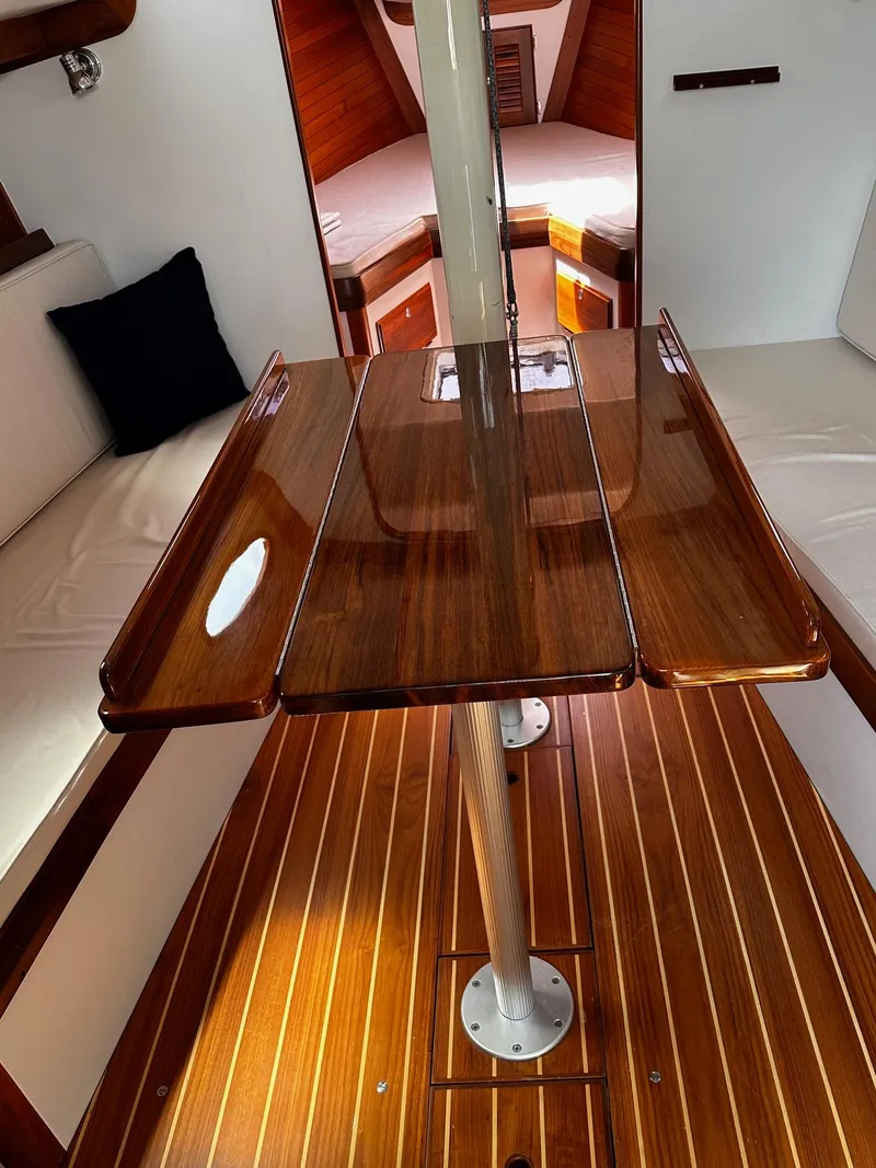 Slide: The Image of Interior of 2009 Alerion Express 38 sailboat with polished wood table and seating. - 24