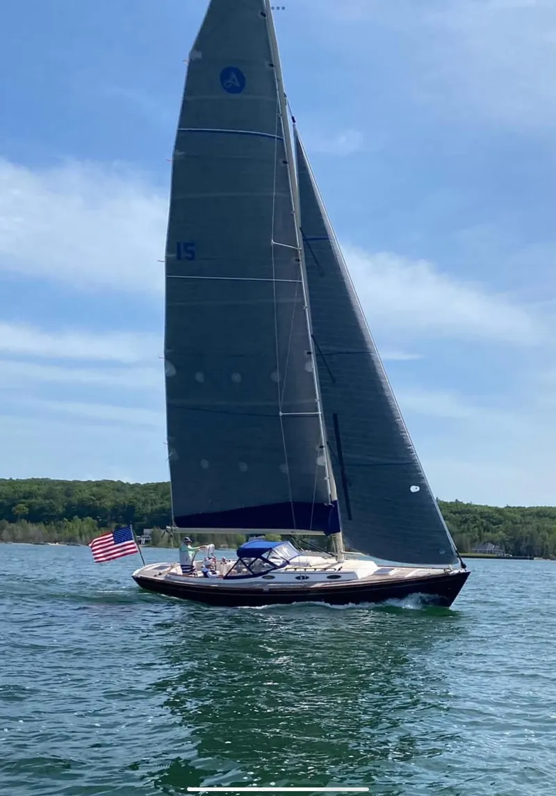 Slide: The Image of Sailing yacht Alerion Express 38 (2009) on a sunny day with American flag. - 3