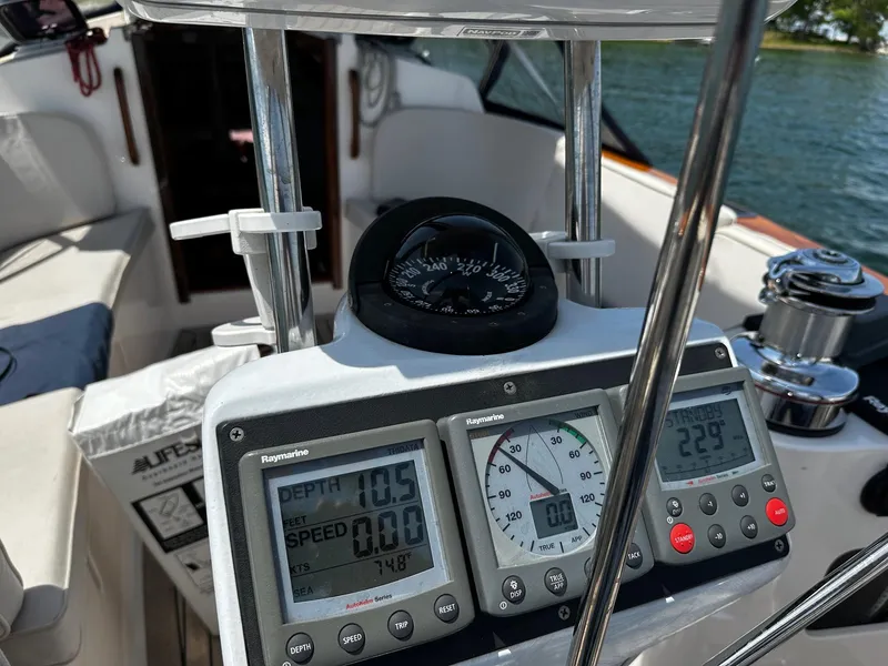 Slide: The Image of Cockpit of 2009 Alerion Express 38 sailboat with navigation instruments and compass. - 35