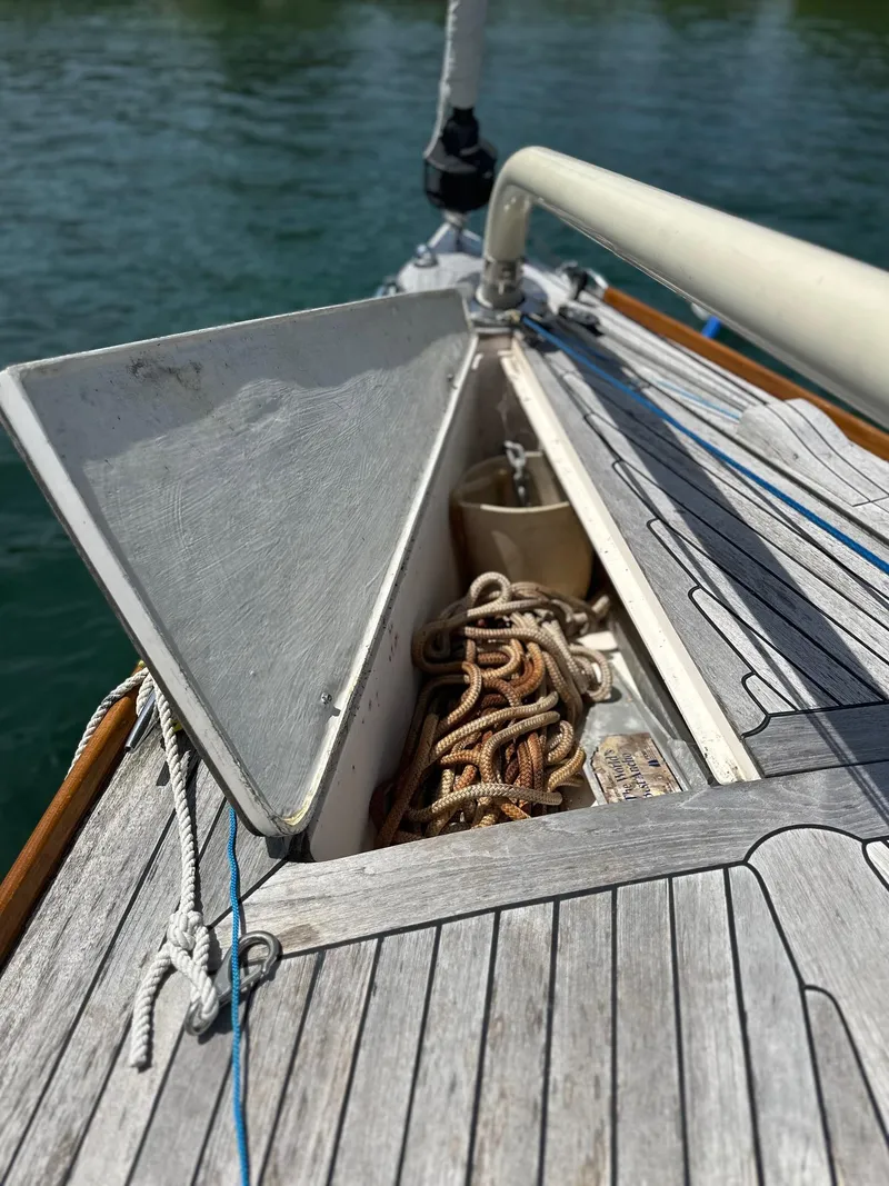 Slide: The Image of Open anchor locker on 2009 Alerion Express 38 sailboat, showing ropes and equipment. - 38