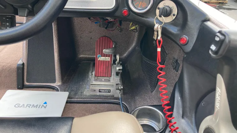 Slide: The Image of 2012 Skeeter FX 20 boat cockpit with Garmin device and Hot Foot throttle. - 12