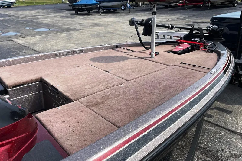 Slide: The Image of 2012 Skeeter FX20 bass boat with Minn Kota trolling motor on deck. - 17