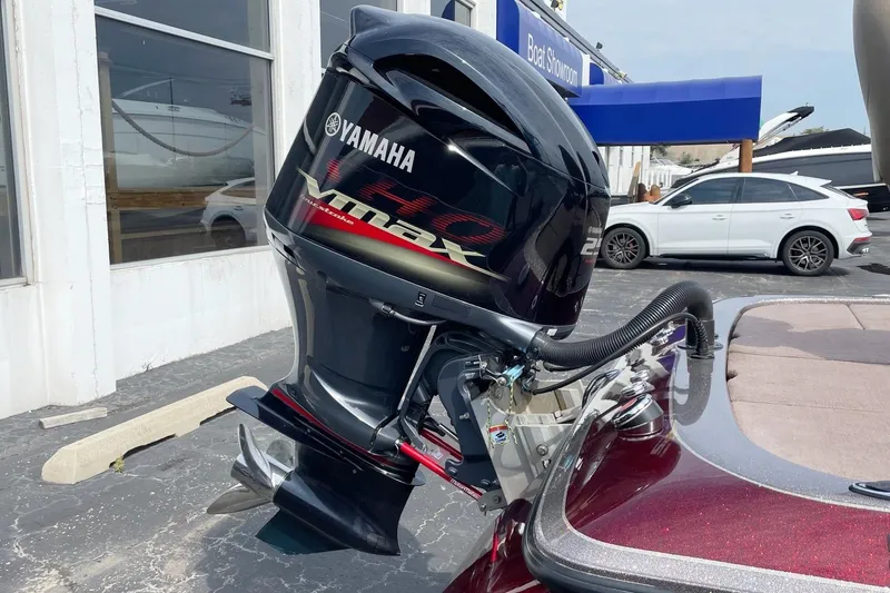 Slide: The Image of 2012 Skeeter FX20 with Yamaha VMAX outboard motor at a boat showroom. - 20