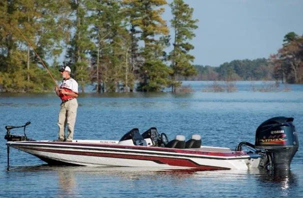 Slide: The Image of 2012 Skeeter FX 20 bass boat with Yamaha engine, red and gray interior. - 8