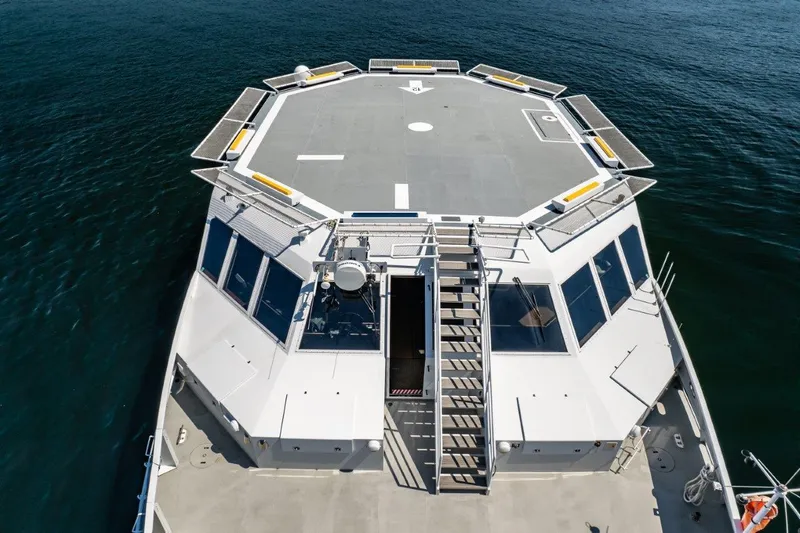 Slide: The Image of Helicopter-capable catamaran deck by Dakota Creek, 1999, on calm water. - 11