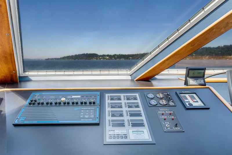 Slide: The Image of Control panel of a 1999 Dakota Creek Catamaran Helicopter Capable, overlooking scenic water view. - 22