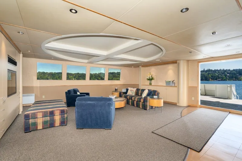 Slide: The Image of Luxurious interior of 1999 Dakota Creek Catamaran with modern seating and scenic water view. - 25