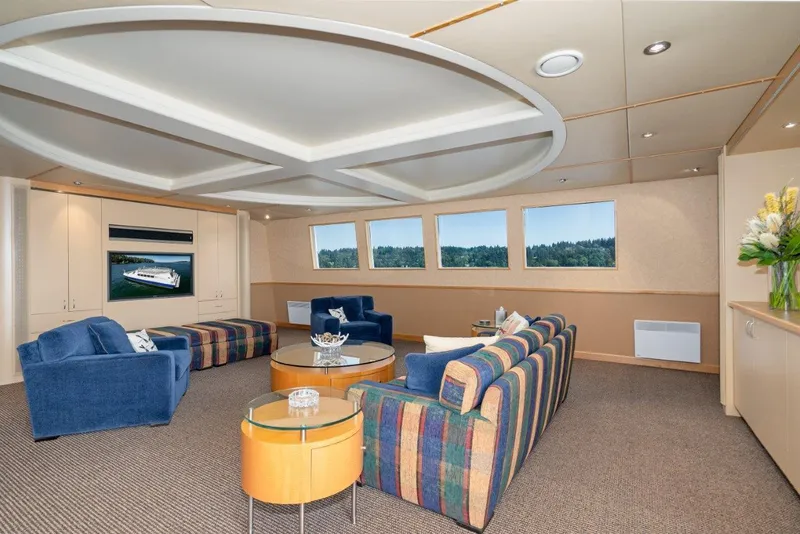 Slide: The Image of Luxurious interior of 1999 Dakota Creek Catamaran, featuring elegant seating and panoramic windows. - 26