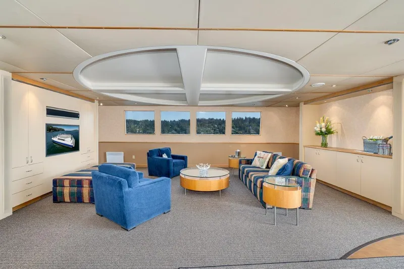 Slide: The Image of Luxurious catamaran interior with modern seating, circular table, and large windows, Dakota Creek 1999 model. - 30