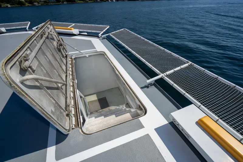 Slide: The Image of Open hatch on 1999 Dakota Creek Catamaran Helicopter Capable deck, overlooking water. - 42