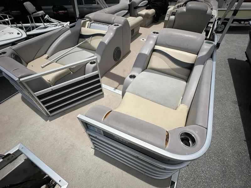 Slide: The Image of 2010 Bennington 2250RCW pontoon boat with spacious seating and cup holders. - 11