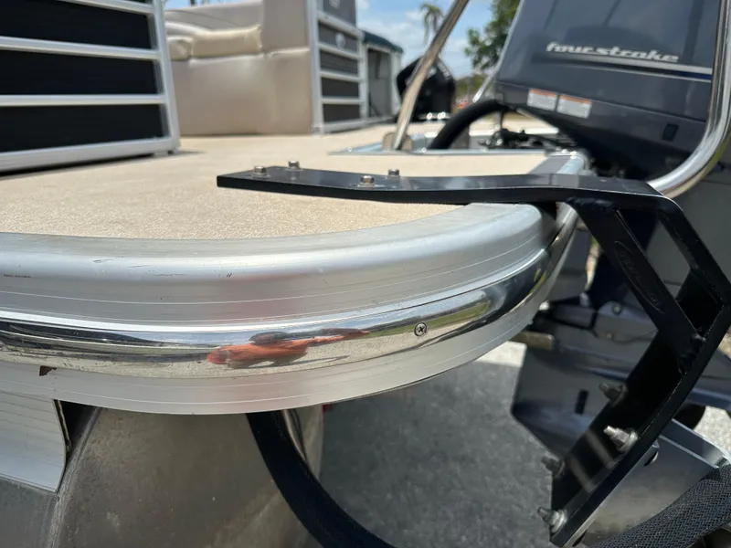 Slide: The Image of 2010 Bennington 2250RCW pontoon boat with a four-stroke outboard motor. - 16