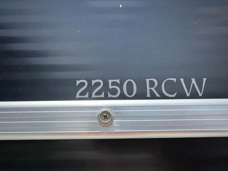 Slide: The Image of 2010 Bennington 2250RCW model nameplate on a metallic surface - 17
