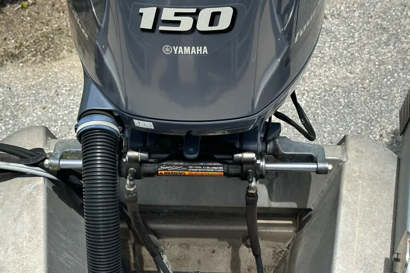 Slide: The Image of Yamaha 150 outboard motor on a 2010 Bennington 2250RCW boat. - 19