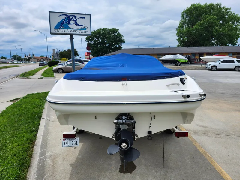 Slide: The Image of 2002 Bayliner 215 Capri boat with blue cover at Premier Boating Center. - 12