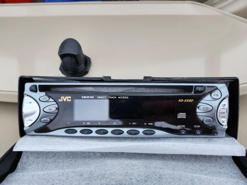 Slide: The Image of JVC car stereo in a 2002 Bayliner 215 Capri boat dashboard. - 16
