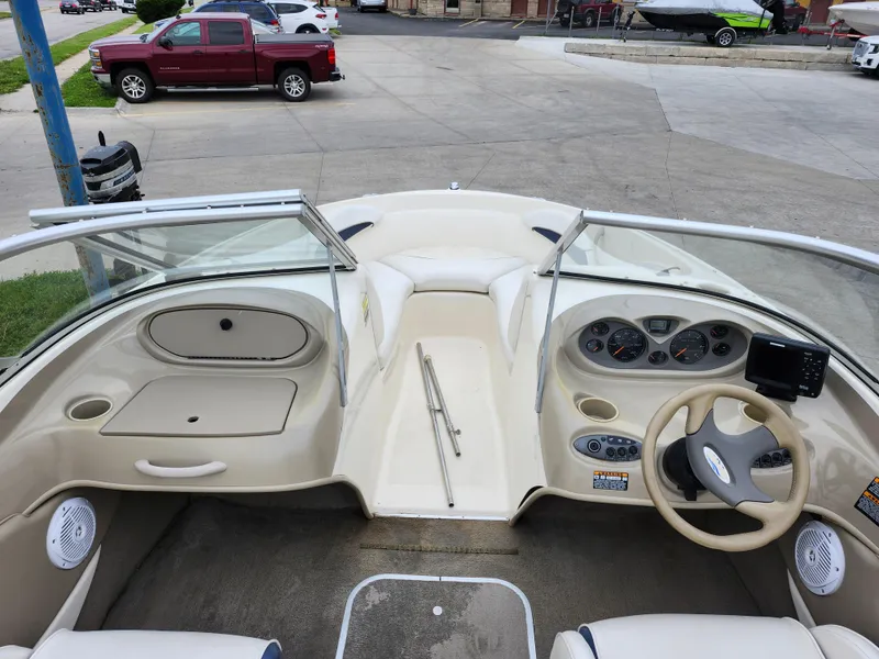 Slide: The Image of 2002 Bayliner 215 Capri boat interior with steering wheel and dashboard. - 19