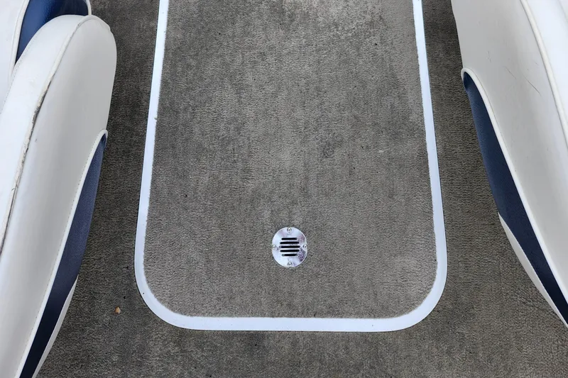 Slide: The Image of 2002 Bayliner 215 Capri boat interior floor with drain. - 25
