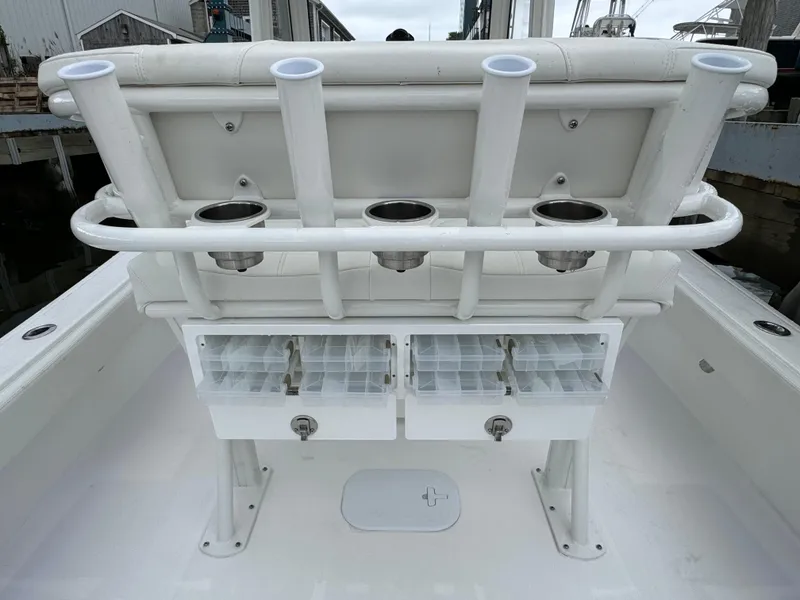 Slide: The Image of 2025 Regulator 24XO boat with rod holders and storage compartments. - 18