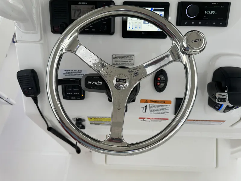Slide: The Image of Steering wheel and control panel of 2025 Regulator 24XO boat. - 22