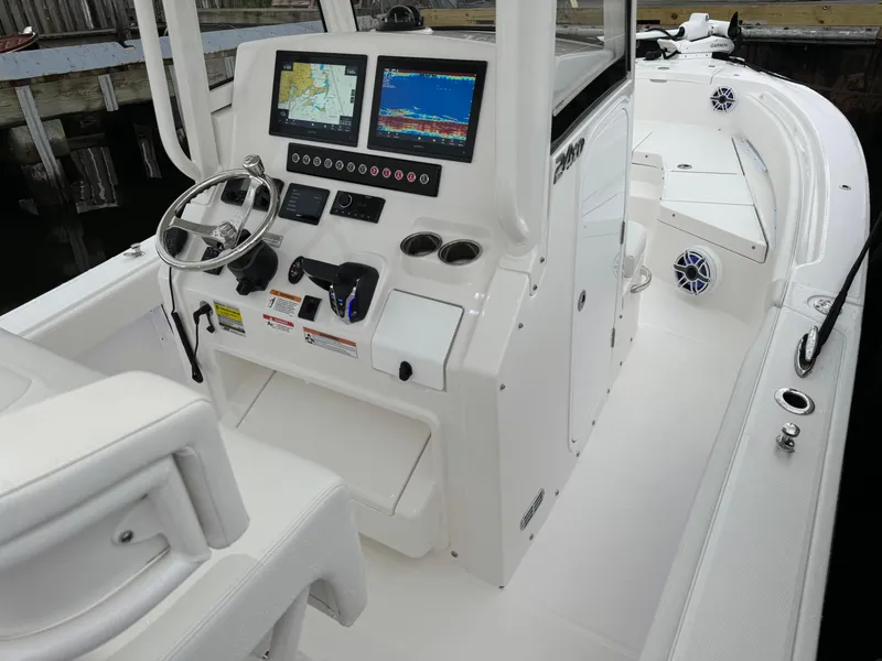 Slide: The Image of 2025 Regulator 24XO boat cockpit with advanced navigation system and controls. - 24