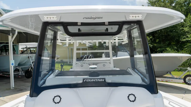 Slide: The Image of 2025 Fountain 38 TE boat, rear view, docked at marina. - 13