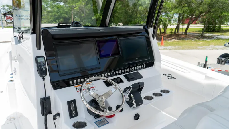 Slide: The Image of Fountain 38 TE 2025 boat dashboard with modern navigation screens and controls. - 17