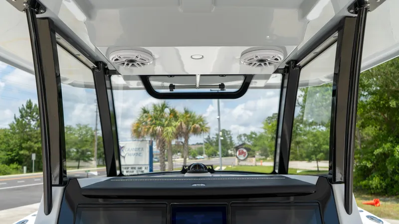 Slide: The Image of Interior view of 2025 Fountain 38 TE boat cockpit with speakers and windshield. - 19