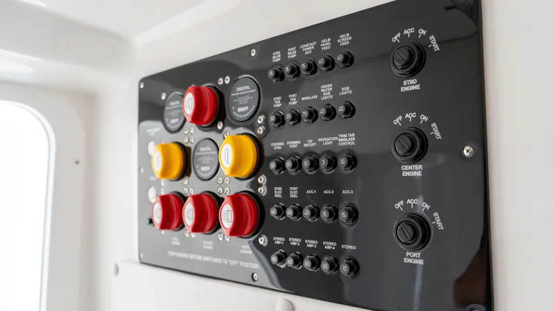 Slide: The Image of Control panel of 2025 Fountain 38 TE boat with switches and buttons. - 21