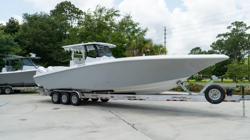 Slide: The Image of 2025 Fountain 38 TE boat on a trailer in a parking lot. - 3