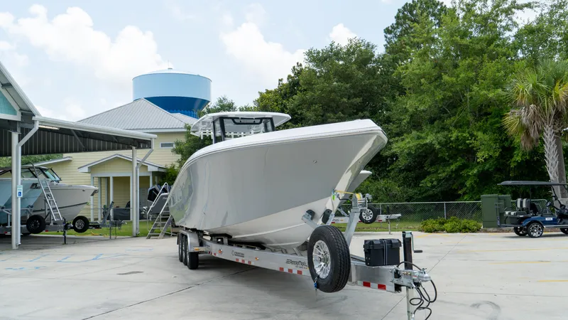 Slide: The Image of 2025 Fountain 38 TE boat on a trailer in a marina. - 4