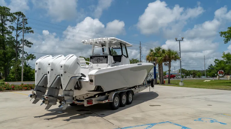 Slide: The Image of 2025 Fountain 38 TE boat with triple outboard engines on a trailer. - 8