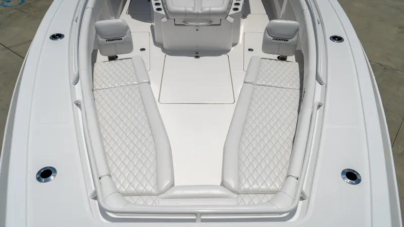 Slide: The Image of 2025 Fountain 38 TE boat interior with white diamond-stitched seating. - 9